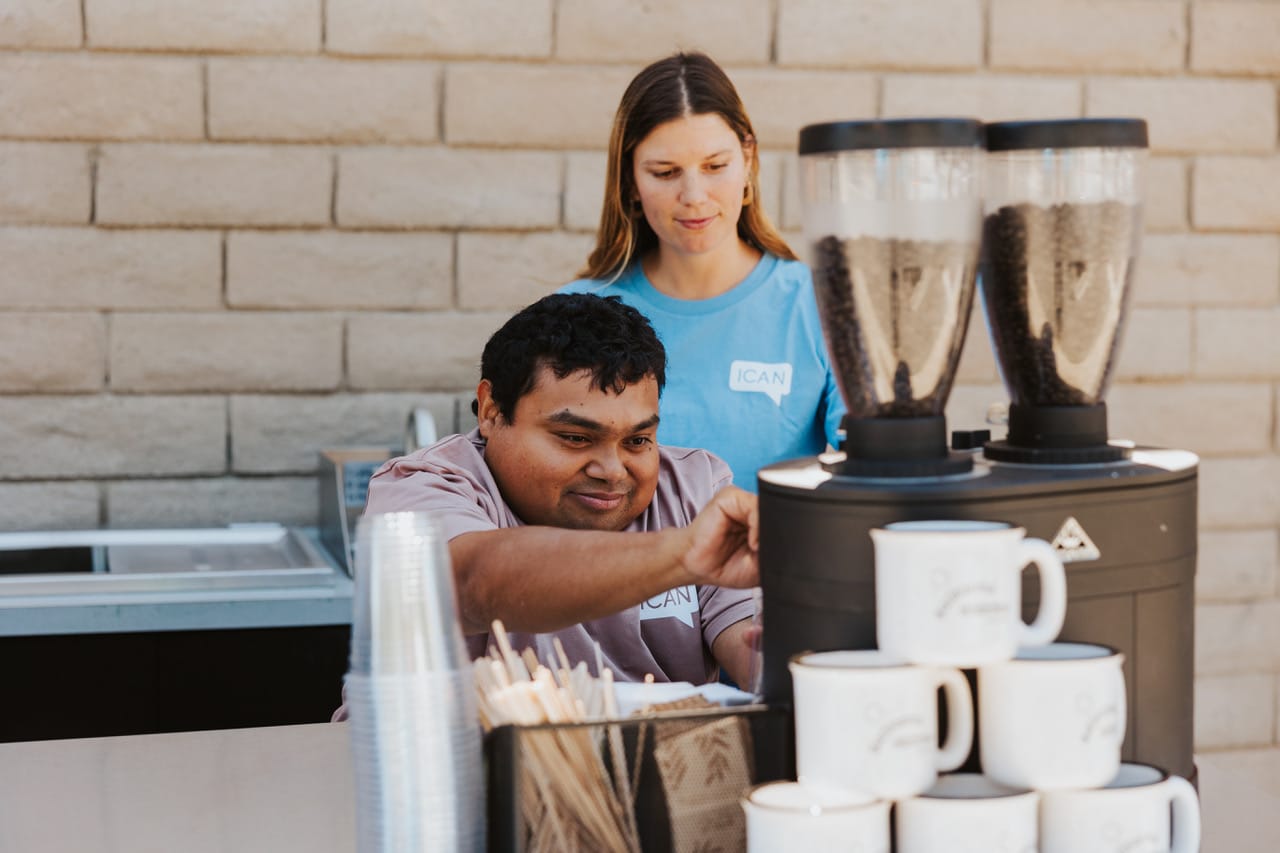 ICAN client working at the ICAN Coffee Cart