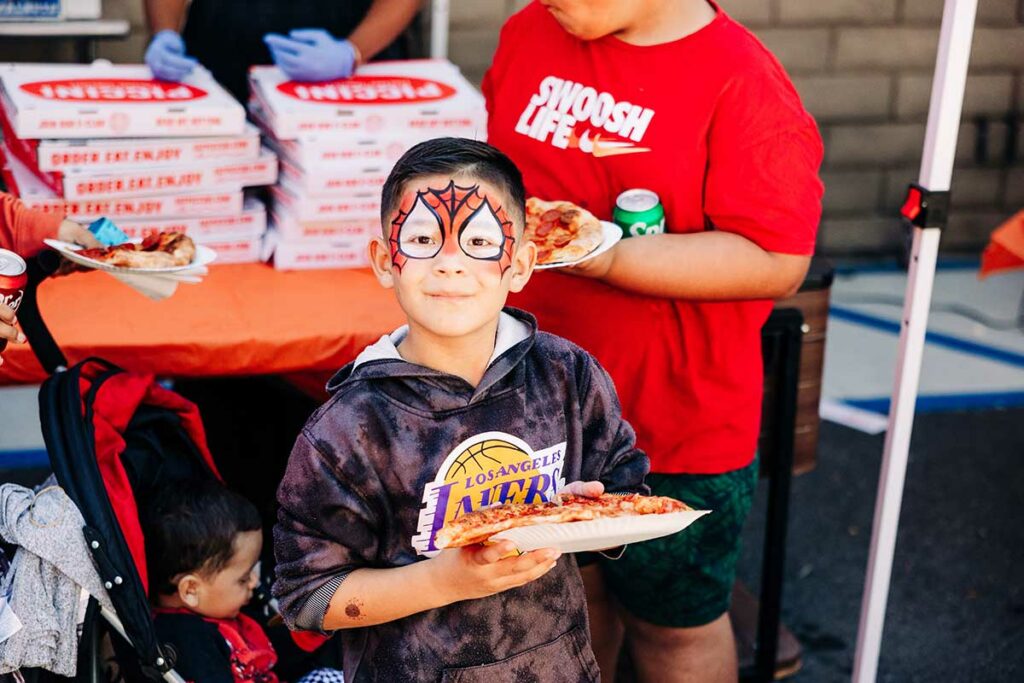 kid with cool face paint at ICAN Halloween Fest 2023