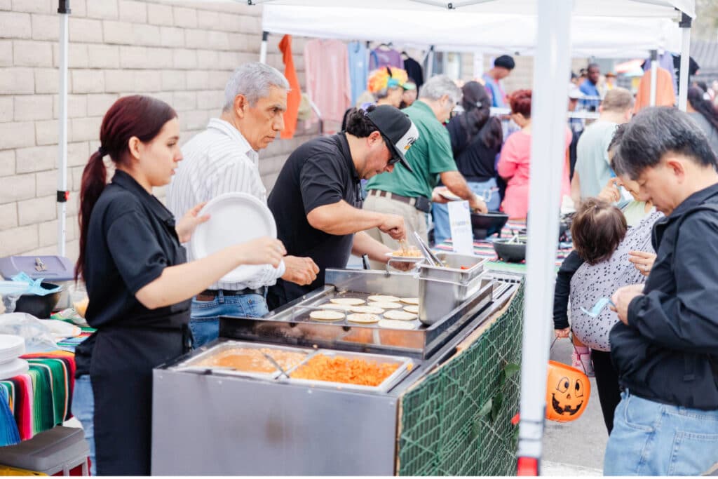 Tacos being made at ICAN Halloween fest 2024